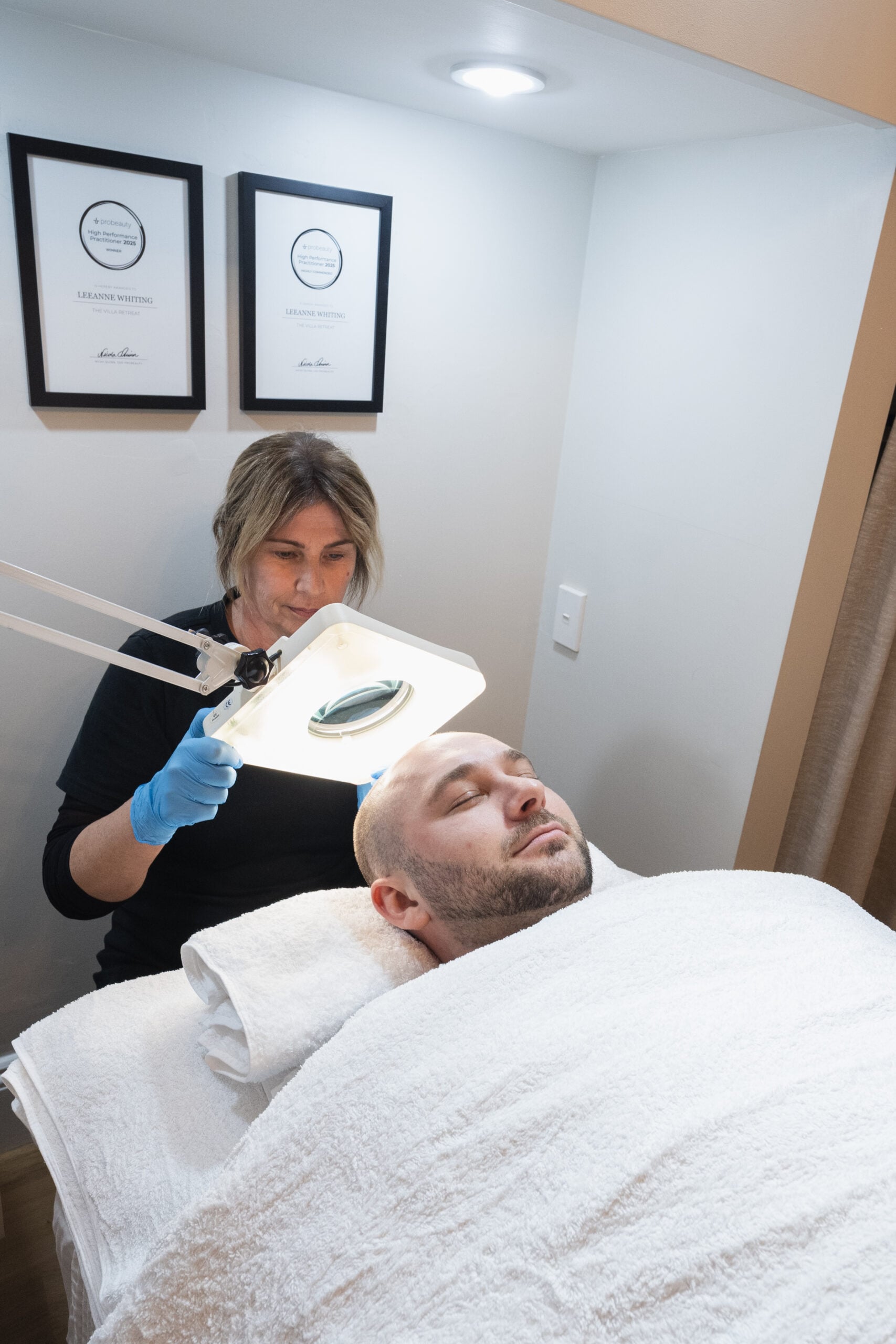 Leeanne Whiting performing a skin treatment